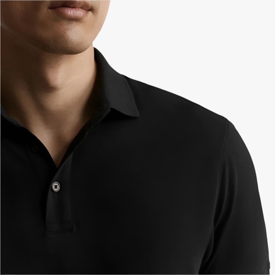 A male model wearing a black polo shirt