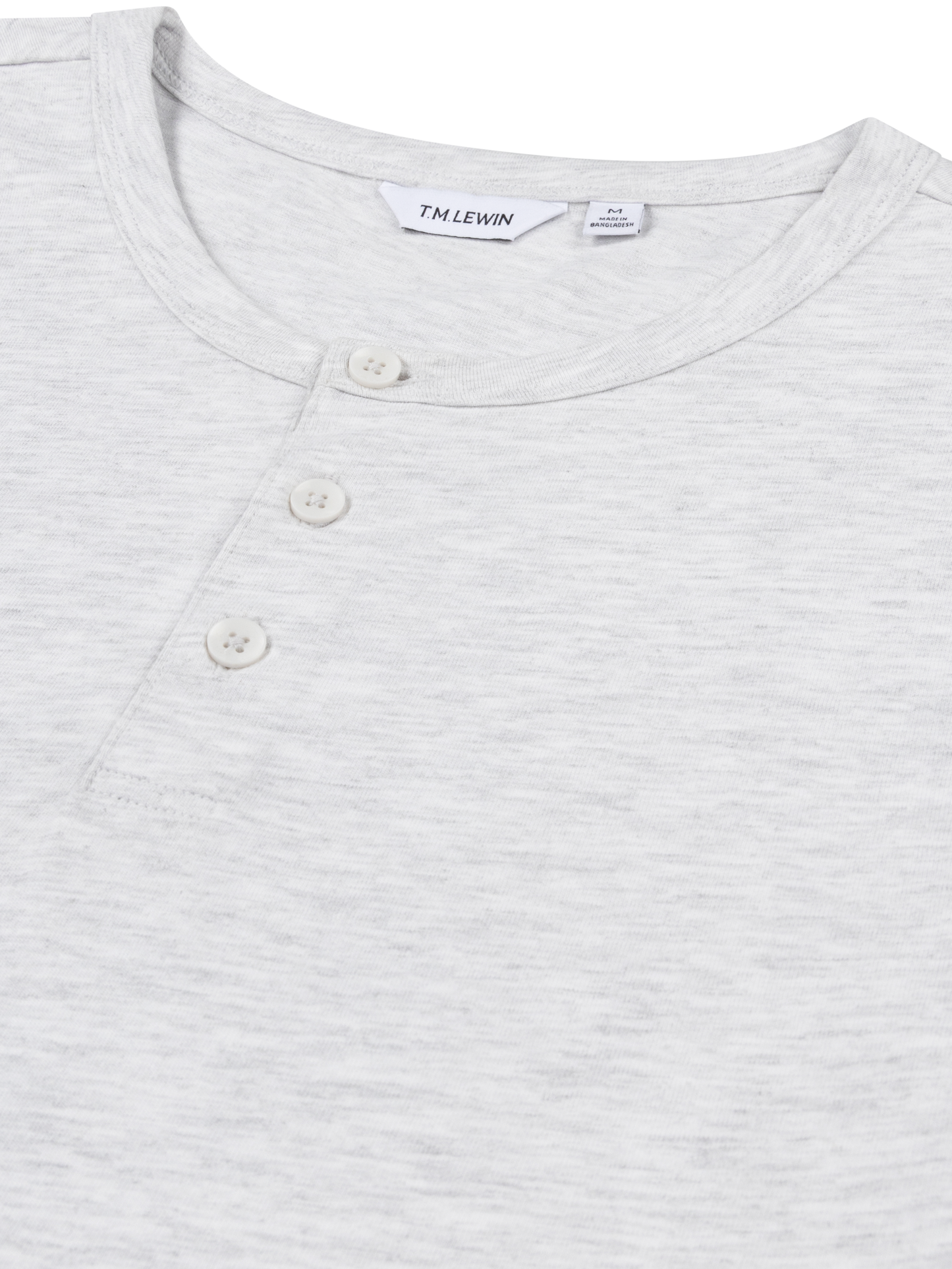 Close-up of the neckline and buttons on a light grey henley shirt